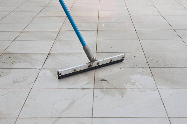 istock swab clean rain water in floor 183602690
