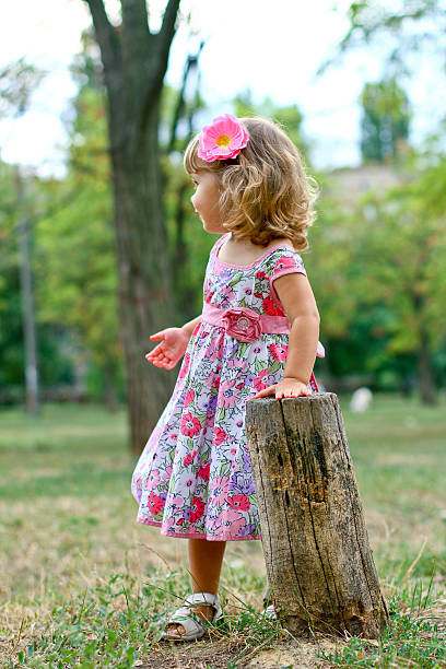 istock Caucasian little girl walking in the park 183607063