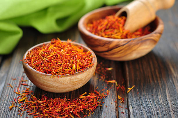 istock Saffron on wooden background 183607360