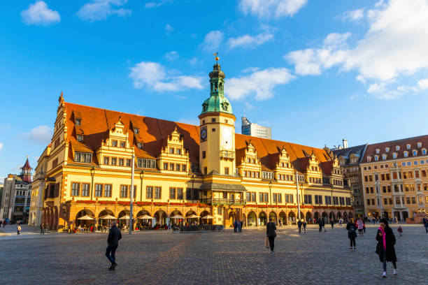 Leipzig, Germany - October 28, 2022: People walk on Markt square (German: Marktplatz) in Leipzig city. Old Town Hall building (German: Altes Rathaus) on background