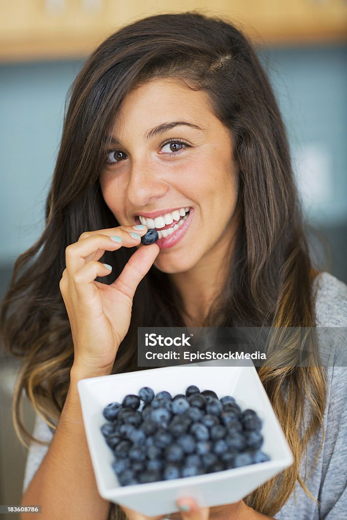 Beautiful woman eating blueberries Beautiful woman eating blueberries, Healthy Food Lifestyle Adult Stock Photo