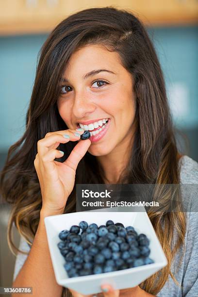 Beautiful Woman Eating Blueberries Stock Photo - Download Image Now - Adult, Antioxidant, Berry