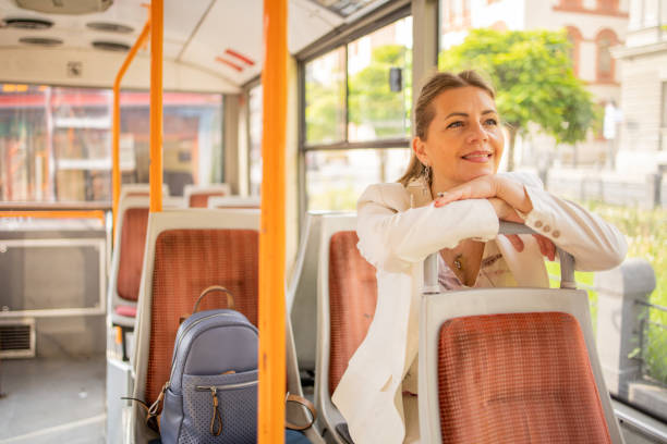 istock Happy mature woman riding public transportation 1836174452