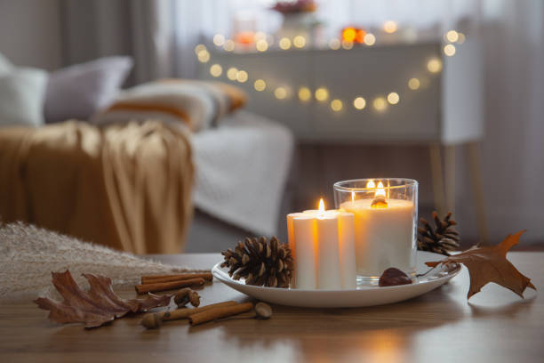 istock autumn and winter home decor with burning candles 1836190850