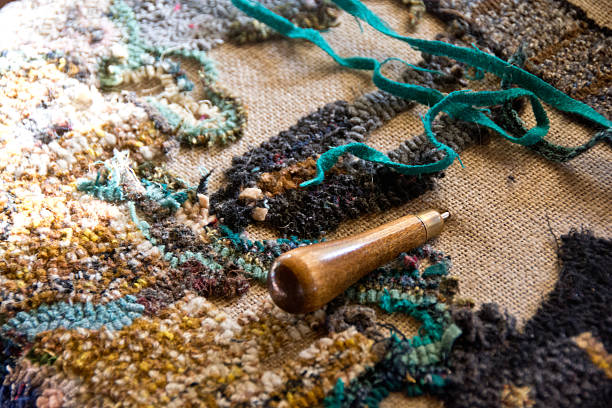 Rug hooking project with turquoise fabric stock photo