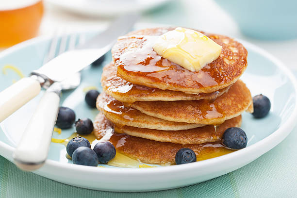 istock american pancakes with syrup and blueberry 183621317