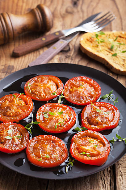 istock baked tomatoes with herbs and olive oil 183621389
