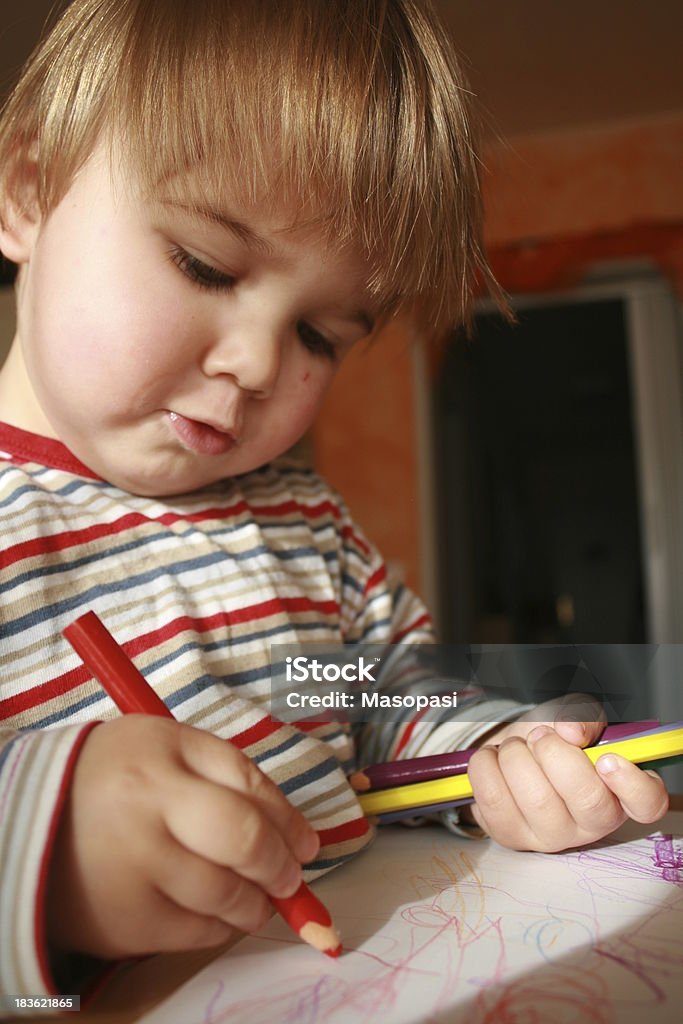 little painter a 1 year old boy  paints Baby - Human Age Stock Photo