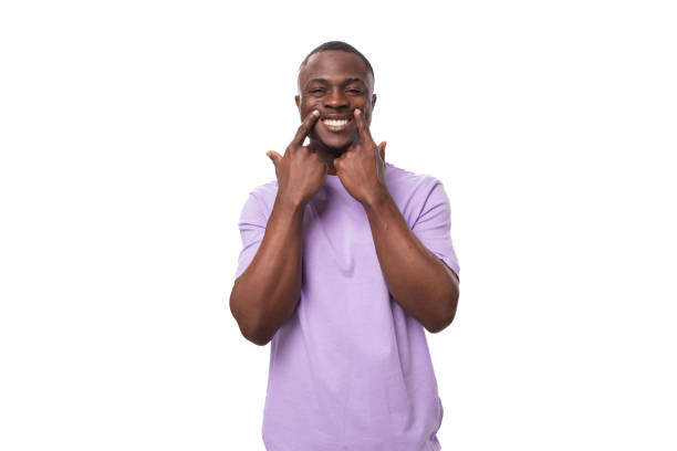 istock young authentic american guy dressed in a light lilac t-shirt surprised on a white background 1836264228