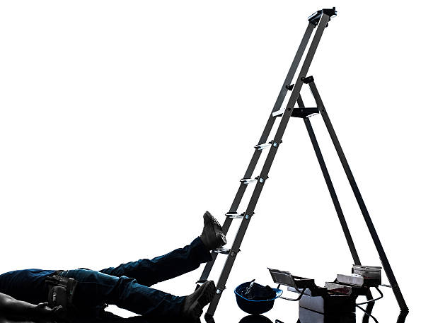 istock accident manual worker man falling from ladder silhouette 183627628