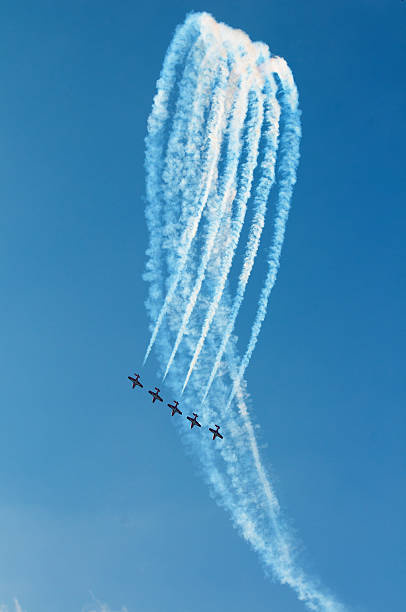 The Canadian Snowbirds demo team in flight - Stock Image The Canadian Snowbirds demo team in flight - Stock Image airshow stock pictures, royalty-free photos & images