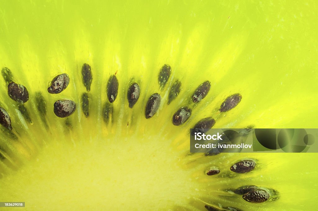 Fresh kiwi fruit bright macro phtoo Refreshing fruit kiwi slice macro with vibrant colors Bright Stock Photo