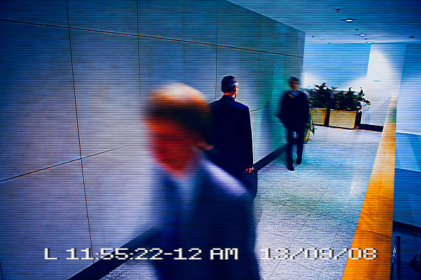 View from surveillance camera Businessmen walking in a corridor viewed from a surveillance camera big brother orwellian concept photos stock pictures, royalty-free photos & images
