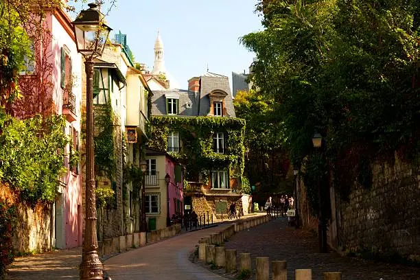 Empty street with coloured houses in Mormartre, Paris