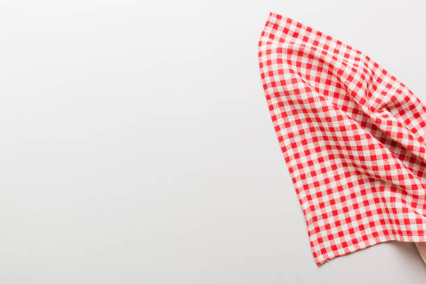 istock top view with red empty kitchen napkin isolated on table background. Folded cloth for mockup with copy space, Flat lay. Minimal style 1836319546
