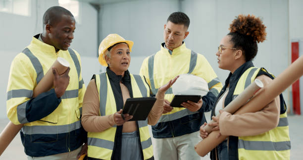 istock Engineering meeting, teamwork and people on tablet for blueprint, construction and building design or planning. Industry manager with digital floor plan, project management and warehouse architecture 1836328951