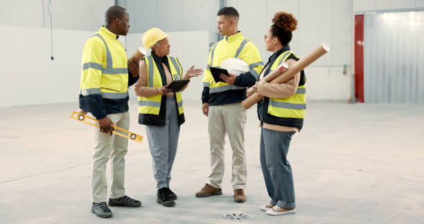 istock Construction site, meeting and business people in a building planning, discussion or or share renovation ideas. Architecture, project management and engineer team in warehouse for design conversation 1836329423