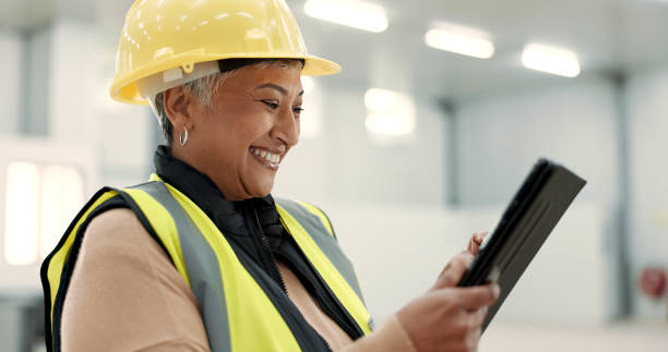 istock Architecture, woman and tablet at construction site warehouse for happy inspection and building or design planning. Excited senior manager on digital technology for industrial software or engineering 1836329463