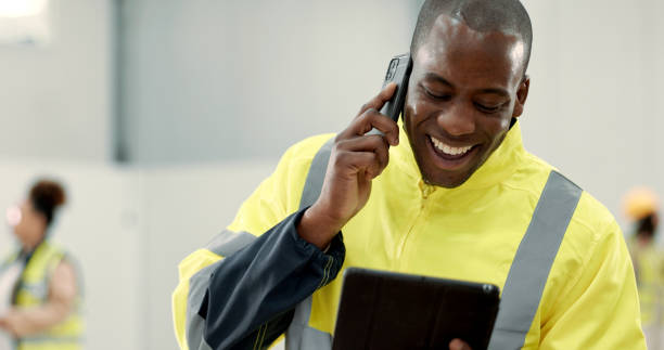istock Happy black man, engineer and phone call with tablet laughing for funny joke, meme or discussion at warehouse. African male person, architect or contractor smile on mobile smartphone for conversation 1836329468