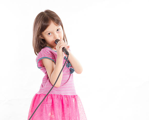 istock Asian girl singing with microphone 183633527