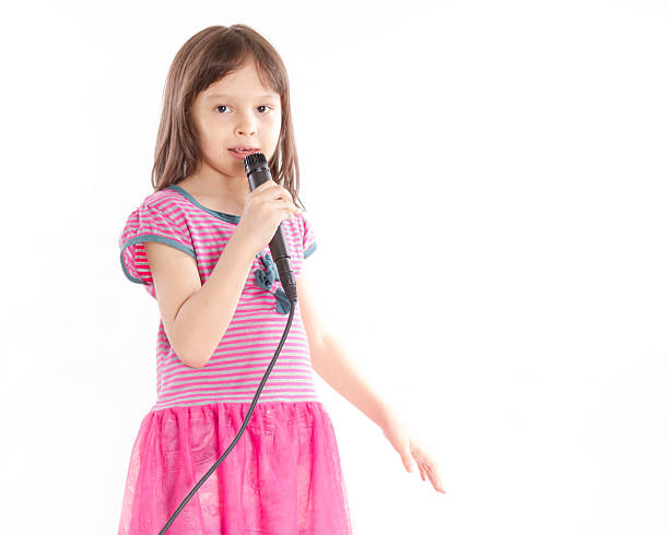 istock Asian girl singing with microphone 183633531
