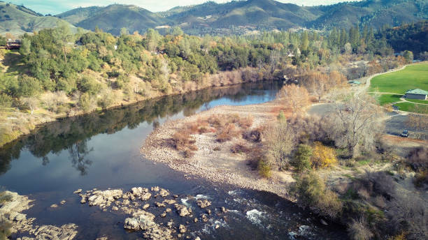 istock Drone Flight Over American River, California in Autumn 1836337295