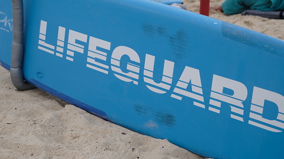Lifeguard surfing board on a on the sandy beach