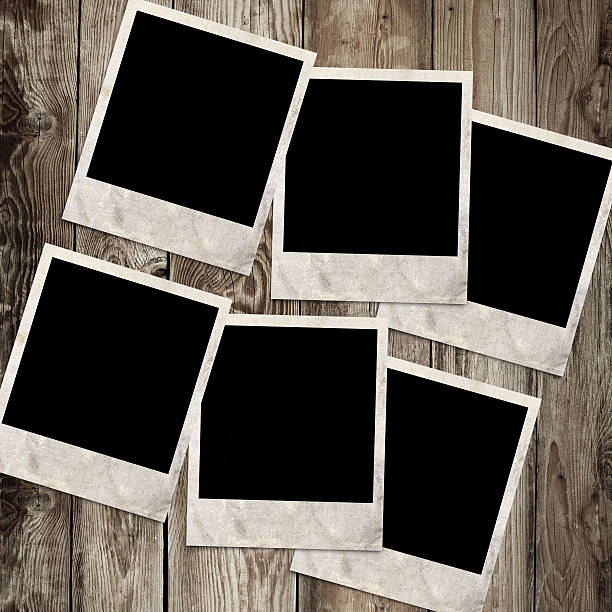 istock photo frames on wooden background 183636369