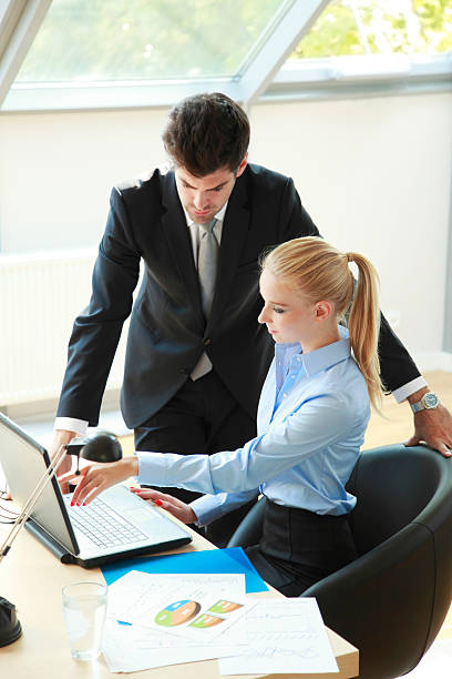 istock Businesscouple Working On Laptop 183638853