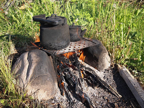 istock Teapot and kettle on a fire in the summer 183640190