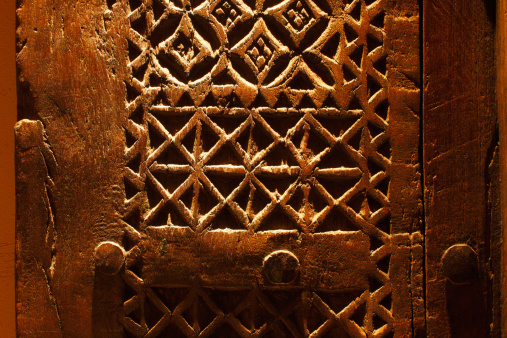 An ancient hand carved door from Arabia, the design is wonderfully interact and it's irregularity exemplifies that it was definitely hand carved