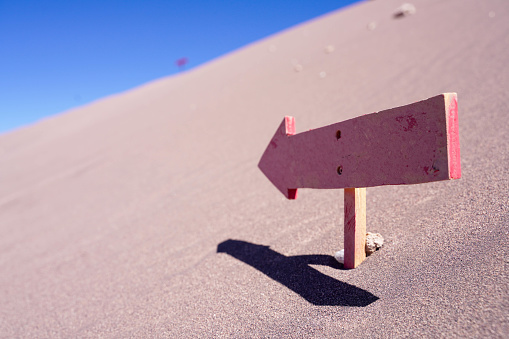Guide sign on Sand dune in the Atacama Desert