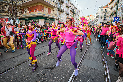 Lisbon, Portugal - February 18, 2023: Carnival parade in streets of Lisbon by artistic collective Clandestine Colombina