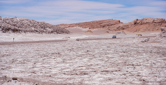 Vehicle in the distance crossing the Atacama desert.