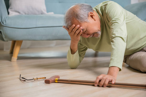 istock Older senior man headache lying on the floor after falling 1836456128