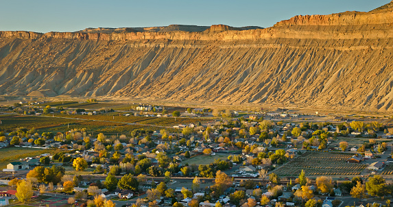 Aerial shot of a canyon in Mesa County, close to the town of Palisade in Colorado, on a clear day in Fall.