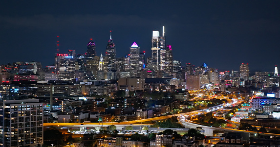 Aerial still image of the urban skyline of Philadelphia, Pennsylvania, from Northern Liberties neighborhood, on an overcast night.\n\nAuthorization was obtained from the FAA for this operation in restricted airspace.