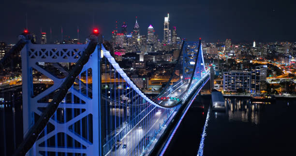 istock Ben Franklin Bridge and Philadelphia Skyline in the Backdrop at Night - Drone View 1836545385