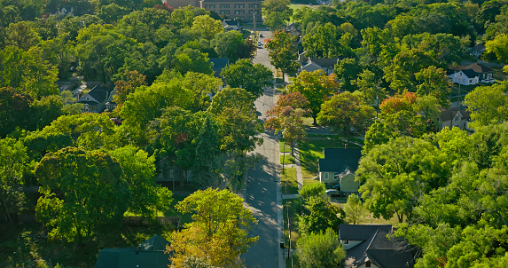 Aerial view of residential street in Muskegon, a city in Muskegon County, Michigan, on a clear, sunny day in Fall.\n\nAuthorization was obtained from the FAA for this operation in restricted airspace.