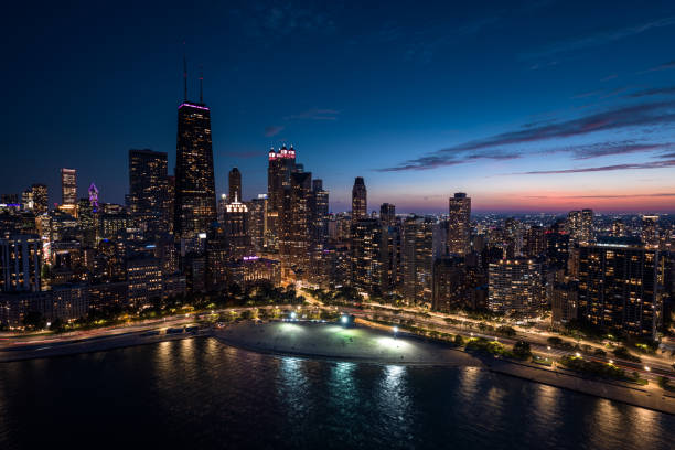 Aerial shot of Oak Street Beach in Gold Coast, Chicago, Illinois at twilight in Fall.