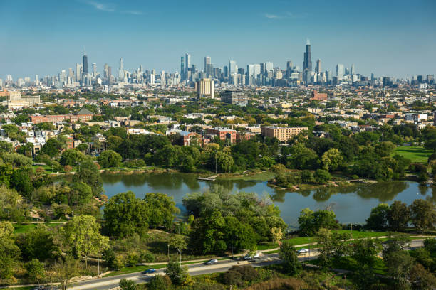 Aerial Shot of Downtown Chicago, Illinois from Humboldt Park Aerial shot of Humboldt Park Lagoon overlooking downtown Chicago, Illinois on a clear day in Fall. chicago neighborhoods stock pictures, royalty-free photos & images