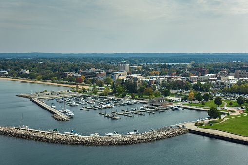 Aerial still of marina in Traverse City, Michigan, on a clear day in Fall.\n\nAuthorization was obtained from the FAA for this operation in restricted airspace.