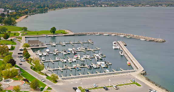 Aerial still of marina in Traverse City, Michigan, on a clear day in Fall.

Authorization was obtained from the FAA for this operation in restricted airspace.