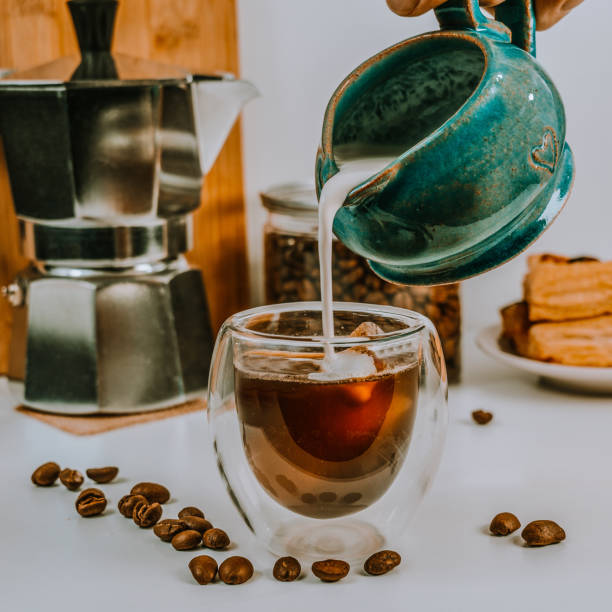 istock Coffee with milk. Fragrant delicious coffee in a transparent cup on the table. Breakfast or coffee break in a cozy cafe. 1836634200