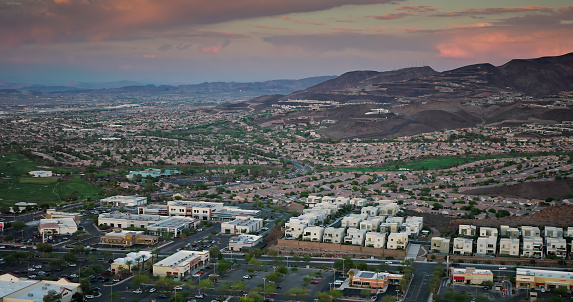 Aerial view of Henderson, a city in Clark County, Nevada, at sunset in Fall.

Authorization was obtained from the FAA for this operation in restricted airspace.