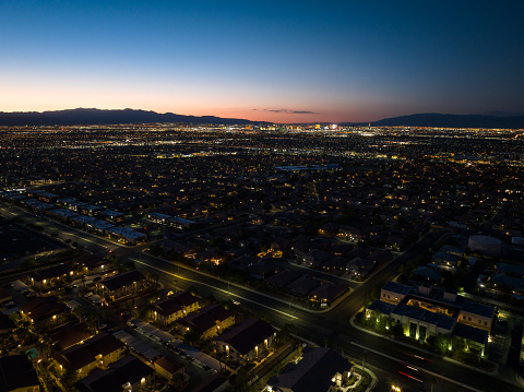 Aerial view of Henderson, a city in Clark County, Nevada, at twilight in Fall.

Authorization was obtained from the FAA for this operation in restricted airspace.