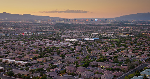 Aerial view of Henderson, a city in Clark County, Nevada, at sunset in Fall.

Authorization was obtained from the FAA for this operation in restricted airspace.