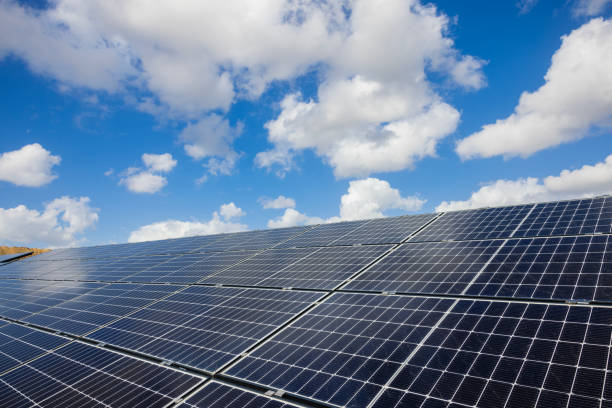 Solar panels with clouds in the background as a concept of renewable alternative solar energy.