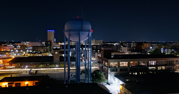 Aerial shot of a water tank in downtown Fargo, North Dakota on a clear, Fall night.

Authorization was obtained from the FAA for this operation in restricted airspace.