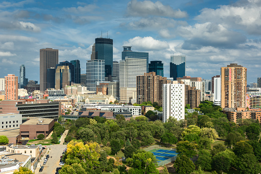 Aerial shot of Minneapolis, Minnesota on a Fall afternoon with scattered clouds.\n\nAuthorization was obtained from the FAA for this operation in restricted airspace.